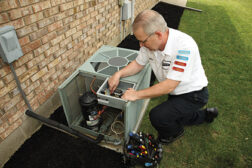 technician working on condensing unit