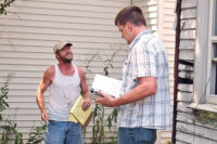 code enforcement official issues ticket to unlicensed contractor