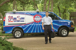 AireServ technician in front of van