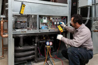 technician tests geothermal system