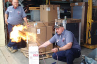 This photo was supplied to The NEWS by contractors from the Lafayette, Ind., area, who were concerned over the sale of a 95 percent propane/butane product promoted for retrofitting into R-22 systems, the demonstrators show the flammability potential.