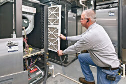 HVAC technician working on geothermal system