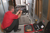 HVAC technician servicing a furnace