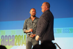 Closing MainStage speaker Doc Hendley (left) is congratulated by outgoing ACCA chairman Bobby Ring (right) following Hendleyâ??s speech at the 2014 ACCA Conference in Nashville.