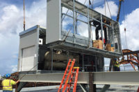 When an MCP is delivered to a site, a crane will lift the pieces into place, then the piping and electrical interconnections between modules will be reconnected. (Courtesy, Daikin Applied)