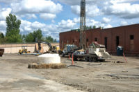 A bore is drilled for the closed-loop ground source system at SIERR Building at McKinstry Station in Spokane, Washington. (Photo by McKinstry)