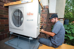 Andert makes a flare connection on the Rounerâ??s Fujitsu multi-zone condensing unit.
