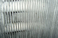 Here is the same cooling coil at Lackland Air Force Base after UV-C was installed. UV-C lamps are currently the best solution to provide 24/7 cleaning of coils.