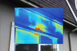 This thermal image shows air exfiltration above exterior window frame.