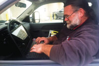 Nate Morse, technician team leader, AirTight, Charlotte, North Carolina, works out of his truck while on a job site.