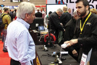 Andrew Micallef, product development engineer, General Tools & Instruments, discusses the companyÃ¢??s latest offerings with an attendee at the 2015 AHR Expo.