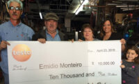 Emidio Monteiro (second to left), owner of Eurotech Climate Systems LLC, Pawtucket, Rhode Island, accepts his Testo Fall 2014 Race Car Trip Sweepstakes winning check with his family.