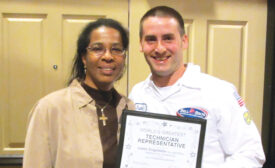 EXCEEDING EXPECTATIONS: At Bell Brothers, a customer presented her own award to technician Justin Engelleiter for providing great service and exceeding her expectations.