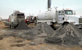 Installing the geothermal heat pump loop field.