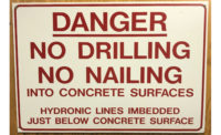 Sign printed with a warning of the radiant tubing installed under the floor.