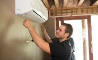 A Restivo’s technician installs a ductless unit for a client.