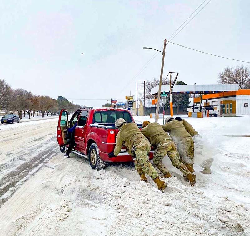 Members of the National Guard teamed up to help a driver during last winter’s ice storm in Texas.