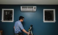 A technician installs a ductless unit in a consumer’s home.