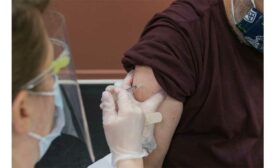 A man in Alaska receives his COVID-19 vaccination.