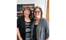 Suzi Zwick (dispatcher), left, and Liz Peterson (accounting), right, from Air Comfort Heating and Cooling.