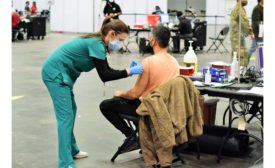 A nurse administers a vaccination at the Javits Center in New York.