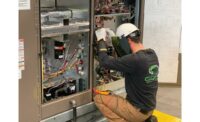 A technician works on a chiller.