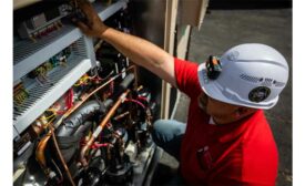 A technician from Jett’s Specialty Contracting works on a unit at an elementary school.