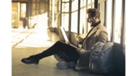 Man with Laptop and Phone