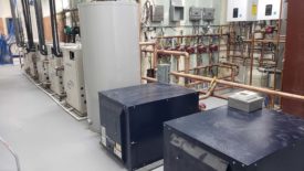 Hybrid water-to-water and water-to-air geothermal system