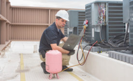 Contractor Servicing HVAC Unit