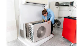 Technician working on heat pump