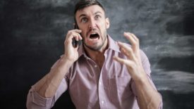 man screaming on phone