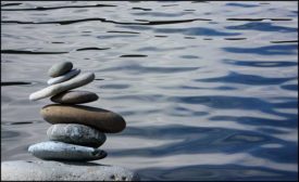 rocks stacked by a lake