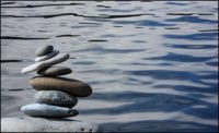 rocks stacked by a lake