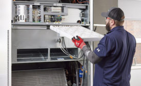 technician working on HVAC system