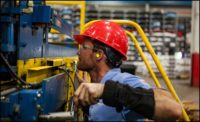 man working on machinery